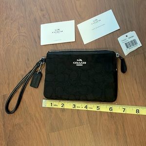 BRAND NEW Coach wristlet with tags.